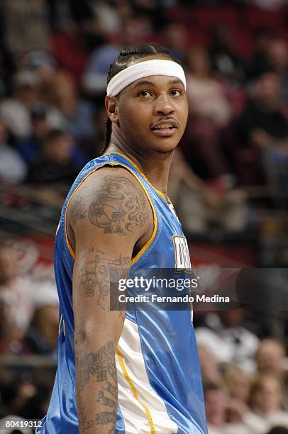 Carmelo Anthony of the Denver Nuggets looks on against the Orlando Magic at Amway Arena on February 13, 2008 in Orlando, Florida. NOTE TO USER: User...