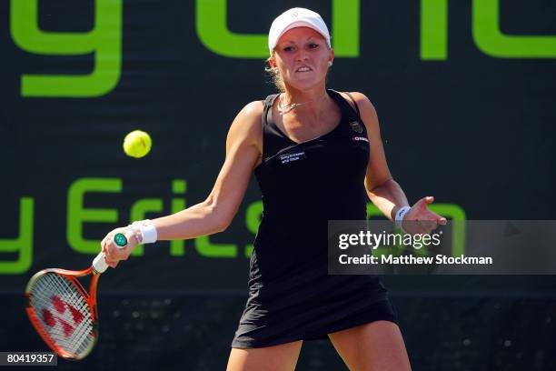 Michaella Krajicek of the Netherlands returns a shot against Marina Erakovic of New Zealand during day five of the Sony Ericsson Open at the Crandon...