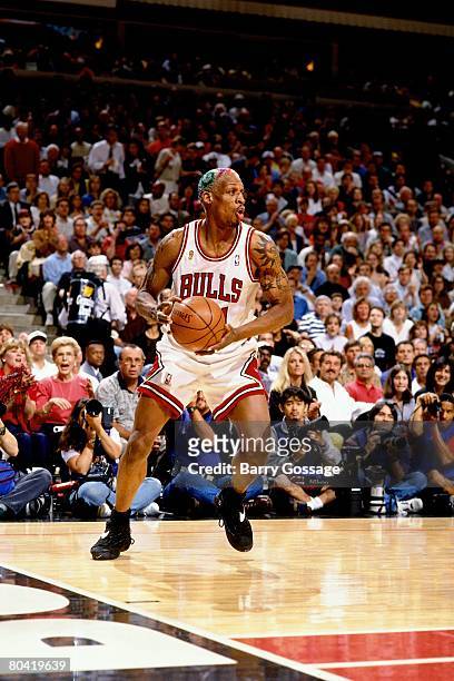 Dennis Rodman of the Chicago Bulls looks to make a move in Game Six of the 1996 NBA Finals against the Seattle SuperSonics at the United Center on...
