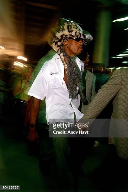 Dennis Rodman of the Chicago Bulls arrives at the arena before playing against the Seattle SuperSonics in Game Six of the 1996 NBA Finals at the...