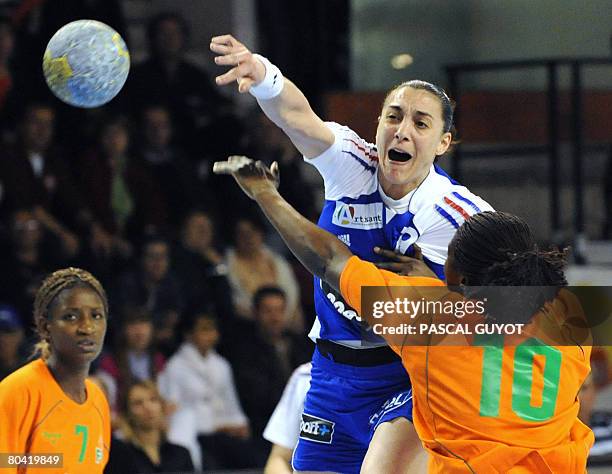 French Christine Vanparys fights for the ball with Ivory Coast's Abony N'Guessan Robeace , on March 28, 2008 in Nimes, southern France, during their...