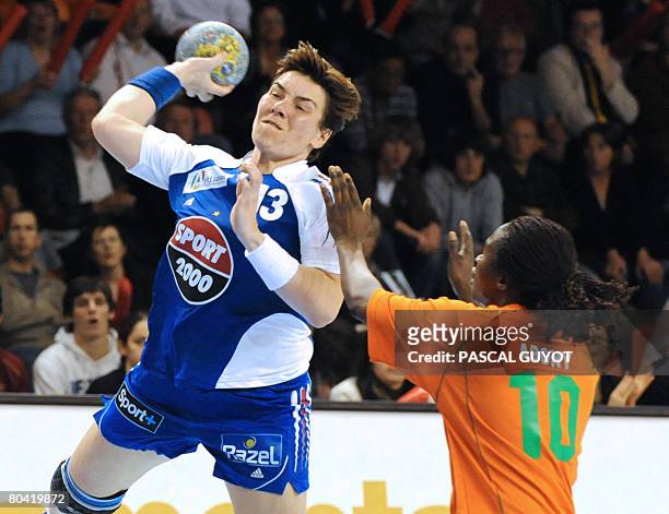 French Isabelle Wendling fights for the ball with Ivory Coast Abony N'Guessan Robeace , on March 28, 2008 in Nimes, southern France, during their...