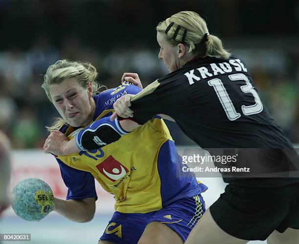 Johanna Ahlm of Sweden is challenged by Nadine Krause of Germany during the women's handball Olympic qualification tournament match between Germany...