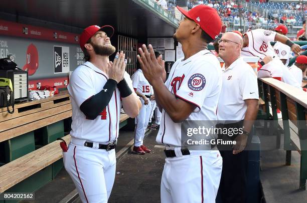 Bryce Harper and Joe Ross of the Washington Nationals talk before the game against the Chicago Cubs at Nationals Park on June 26, 2017 in Washington,...