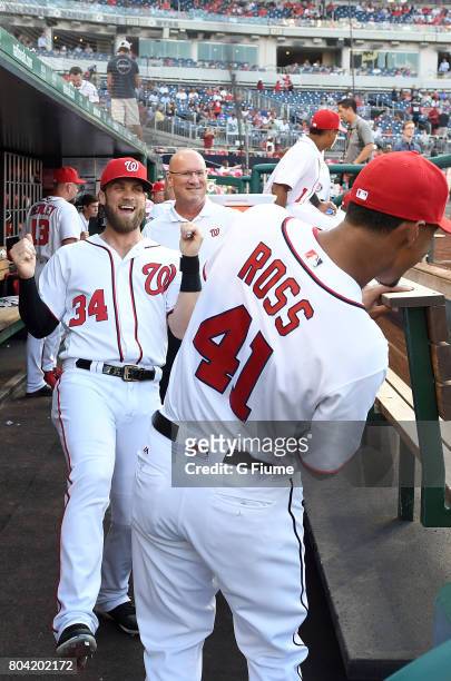 Bryce Harper and Joe Ross of the Washington Nationals talk before the game against the Chicago Cubs at Nationals Park on June 26, 2017 in Washington,...