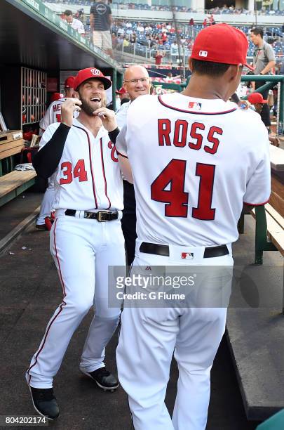 Bryce Harper and Joe Ross of the Washington Nationals talk before the game against the Chicago Cubs at Nationals Park on June 26, 2017 in Washington,...