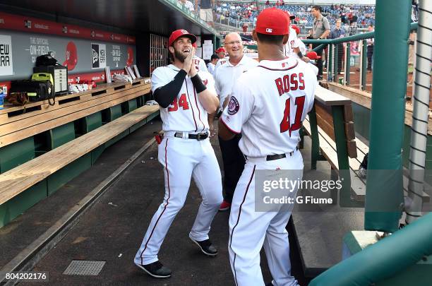 Bryce Harper and Joe Ross of the Washington Nationals talk before the game against the Chicago Cubs at Nationals Park on June 26, 2017 in Washington,...