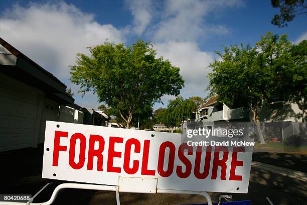 Foreclosure sign stands in the yard of a house to be sold in an upcoming 11-day foreclosure auction of more than 1500 southern California homes March...