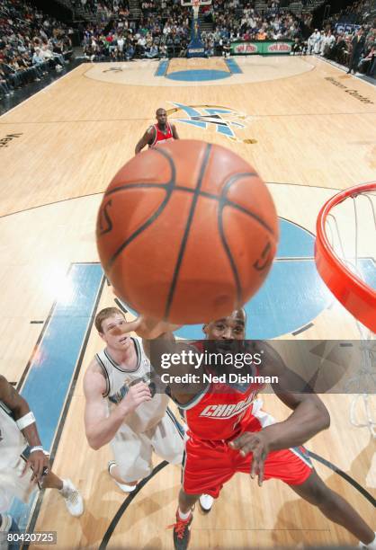 Emeka Okafor of the Charlotte Bobcats lays up a shot against the Washington Wizards during the game at the Verizon Center on March 8, 2008 in...