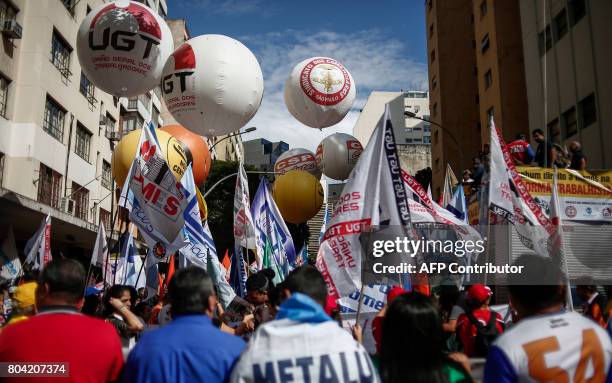 Members of labour unions demonstrate against President Michel Temer's proposed economic reforms, in front of the Labour Ministry egional office in...