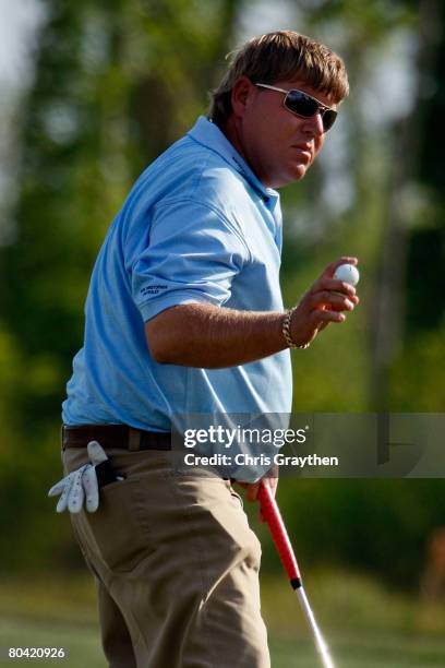 John Daly waves to the crowd after a birdie on the 13th hole during the second round of the Zurich Classic of New Orleans at TPC Louisiana March 28,...