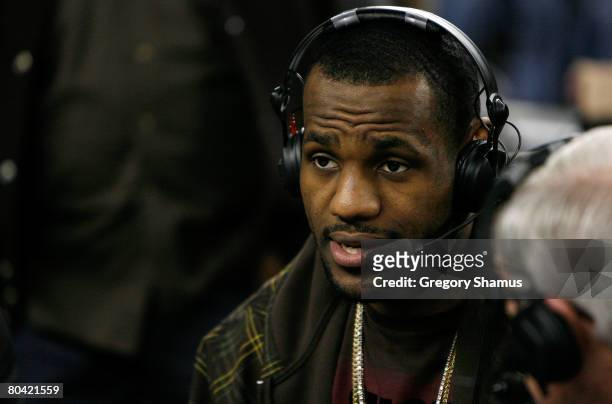 LeBron James of the CLeveland Cavaliers is interviewed at halftime of the game between the Davidson Wildcats and the Wisconsin Badgers during the...