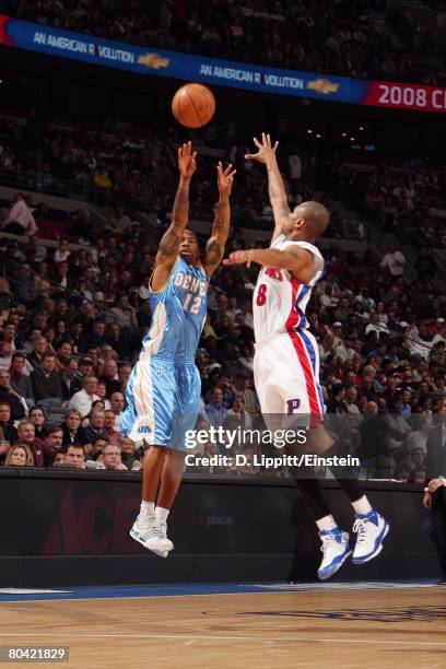 Chucky Atkins of the Denver Nuggets goes up for the shot during the NBA game against the Detroit Pistons at the Palace of Auburn Hills on March 18,...