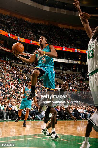 Chris Paul of the New Orleans Hornets shoots against Kendrick Perkins of the Boston Celtics at the TD Banknorth March 28, 2008 Garden in Boston,...