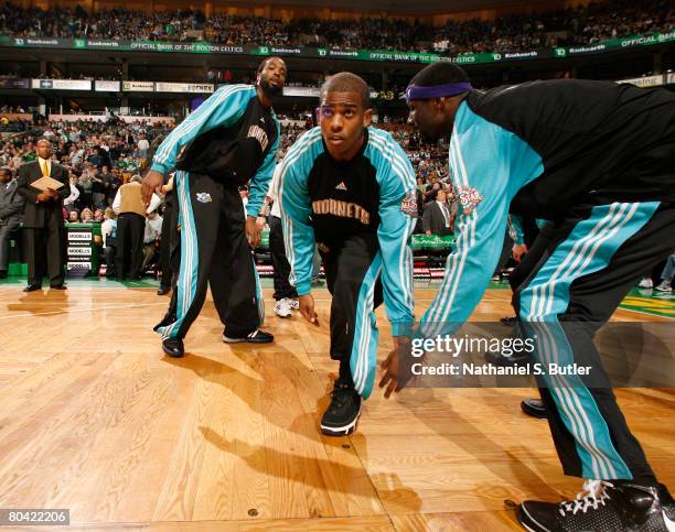 Chris Paul of the New Orleans Hornets greets teammates during team introductions before the game against the Boston Celtics at the TD Banknorth March...