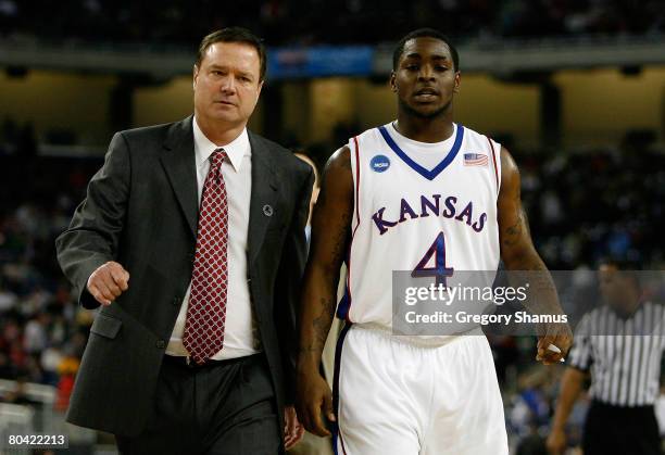 Head coach Bill Self and Sherron Collins of the Kansas Jayhawks walk towards the bench against the Villanova Wildcats during the Midwest Regional...