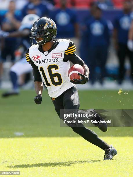 June 25, 2017; Toronto, Ontario, CAN; Brandon Banks of the Hamilton Tiger-Cats returns a kick against the Toronto Argonauts. Toronto Argonauts defeat...