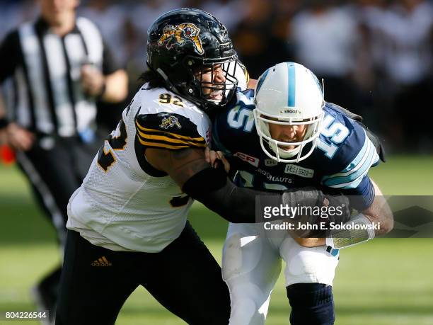 Justin Vaughn of the Hamilton Tiger-Cats sacks Ricky Ray of the Toronto Argonauts during a CFL game at BMO Field on June 25, 2017 in Toronto,...