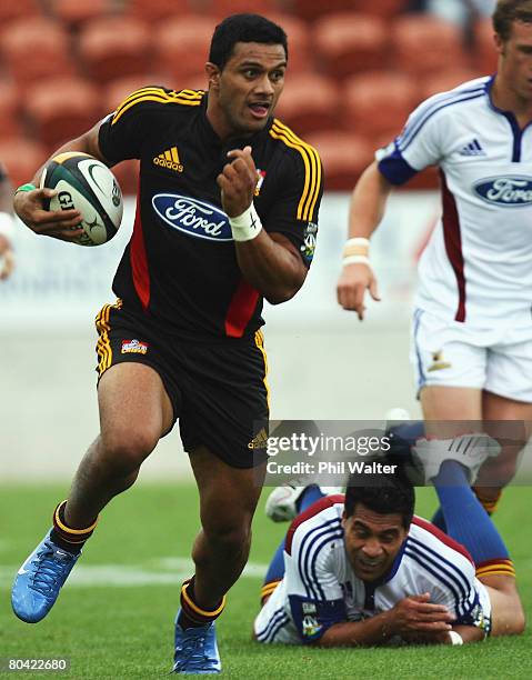 Leila Masaga of the Chiefs leaves Niva Ta'auso of the Highlanders behind during the round seven Super 14 match between the Chiefs and the Highlanders...