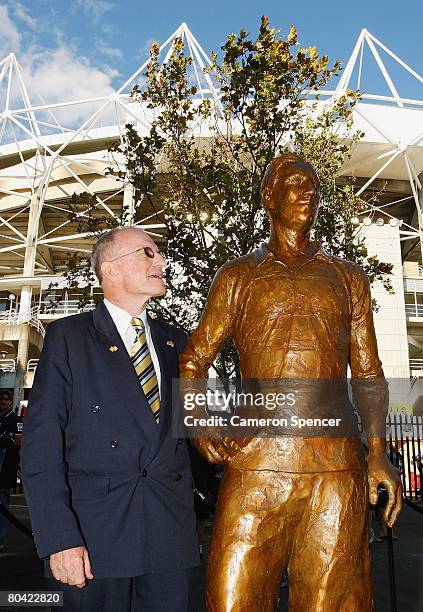 Dally Messenger III stands next to a sculpture of his grandfather Dally Messenger during an offical unveiling as part of the Basil Sellers Sculptures...