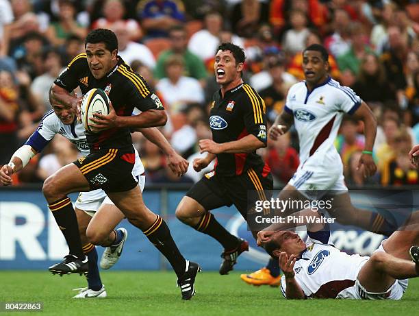 Mils Muliaina of the Chiefs makes a break during the round seven Super 14 match between the Chiefs and the Highlanders at Waikato Stadium on March...