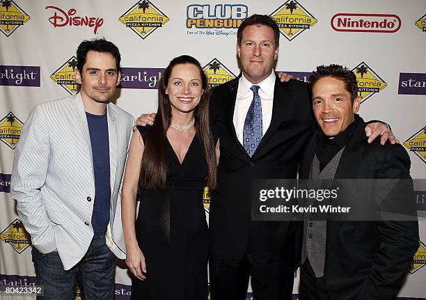 Musician Brad Paisley, Lisa Mayer and Kevin Mayer, Exec. V.P., Walt Disney Company, and musician Dave Koz pose at the Starlight Starbright Children's...