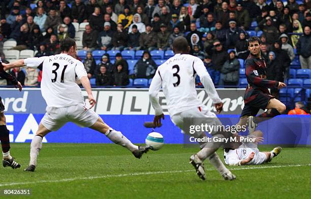 Cesc Fabregas of Arsenal crosses moments before Jlloyd Samuel of Bolton scores an own goal during the Barclays Premiership match between Bolton...