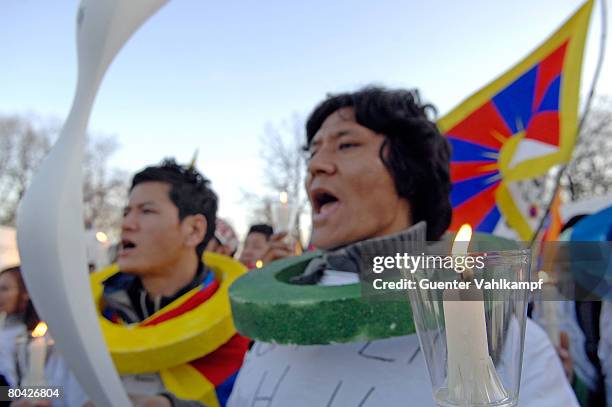 Free Tibet" activists are seen during a demonstration at the Olympia stadion against the Chinese occupation of Tibet and the violent abolition of the...