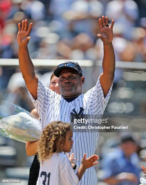 Former New York Yankees pitcher Tim Raines acknowledges the crowd after being introduced for the 71st Annual Old Timers Day at Yankee Stadium on June...