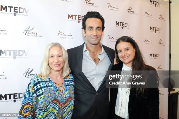 Corie Miller, Dr. Marc Mani and Natasha Philippides attend A Night Out, a fundraising event benefiting #MoveToEndDV hosted by Beverly Hills plastic...