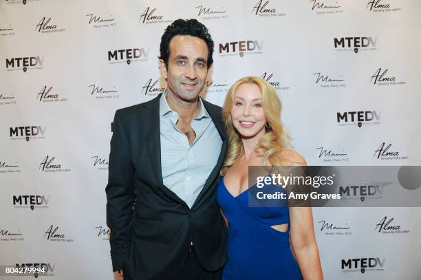 Dr. Marc Mani and Darnell Cox attend A Night Out, a fundraising event benefiting #MoveToEndDV hosted by Beverly Hills plastic surgeon Dr. Marc Mani...