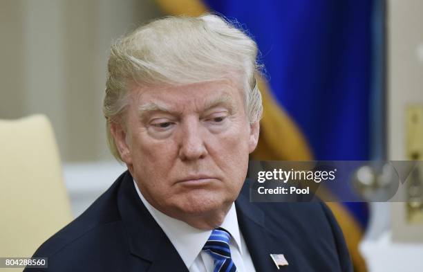 President Donald Trump looks on during a meeting with South Korean President Moon Jae-in in the Oval Office of the White House on June 30, 2017 in...