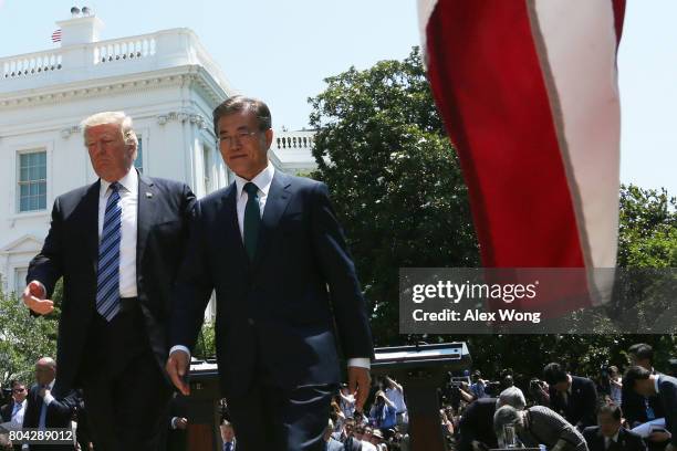 President Donald Trump and South Korean President Moon Jae-in leave after they delivered joint statements in the Rose Garden of the White House on...