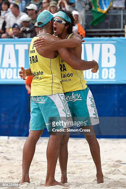 Harley Marques and Pedro Salagdo of Brazil celebrate winning the match during the gold medal match against Penggen Wu and Linyin Xu of China during...