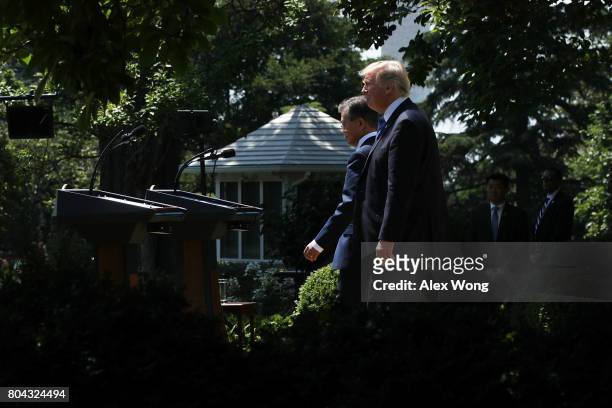 President Donald Trump and South Korean President Moon Jae-in arrive to deliver joint statements in the Rose Garden at the White House on June 30,...
