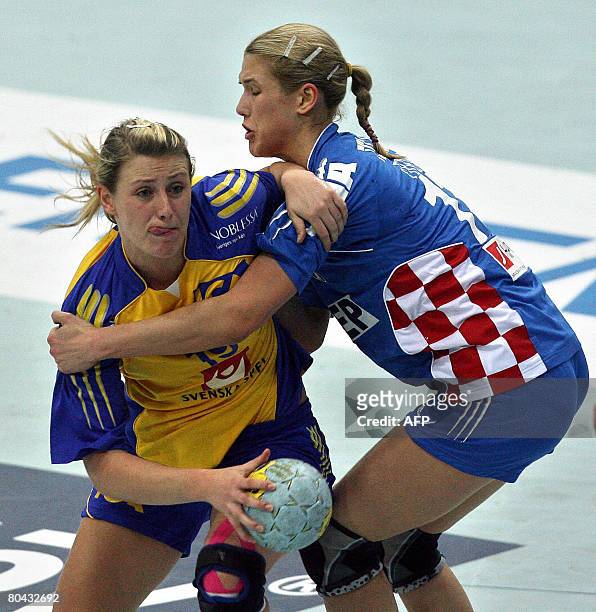 Sweden's Johanna Ahlm vies with Croatia's Maja Zebic during the Women's Olympic qualifying match Sweden vs. Croatia in the eastern German town of...