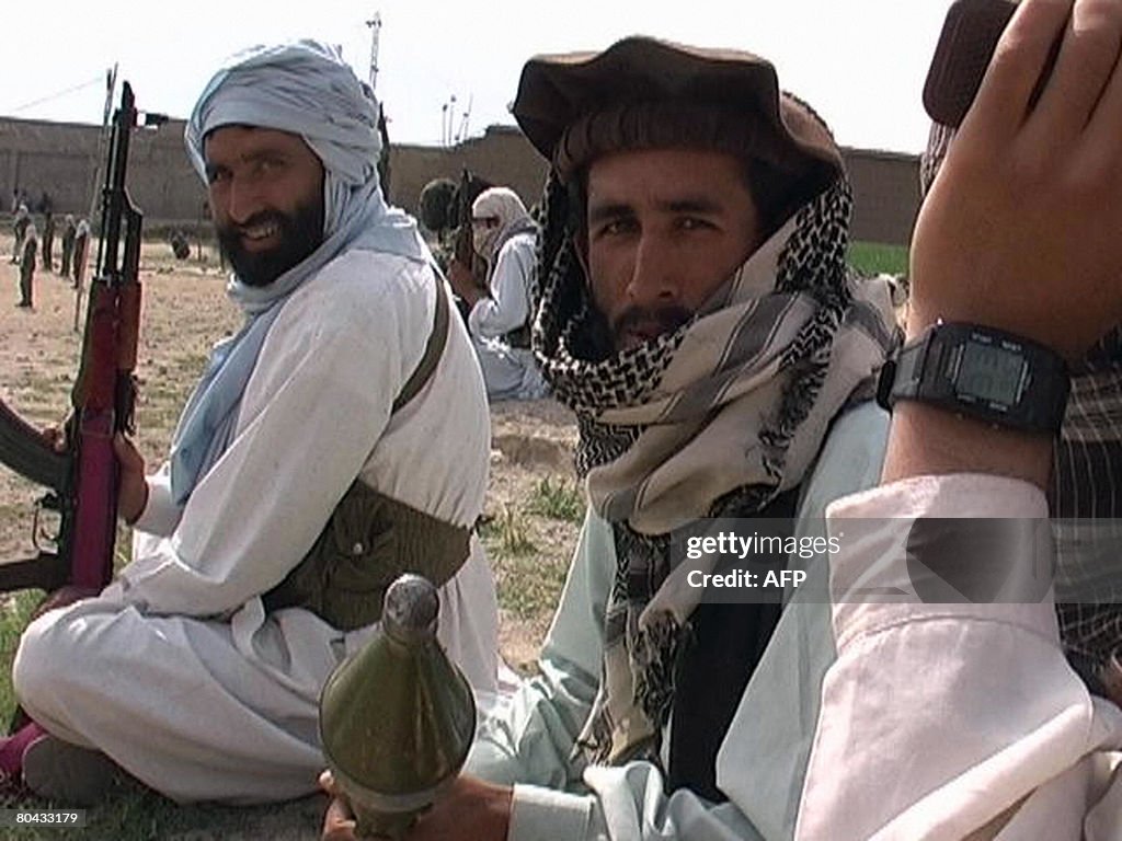 Pakistani Taliban militants gather durin