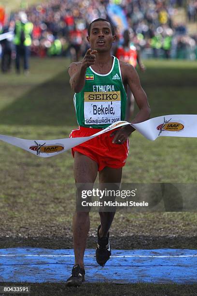 Kenenisa Bekele of Ethiopia celebrates victory and his sixth overall world cross title, in the men's elite race during the 36th IAAF World Cross...