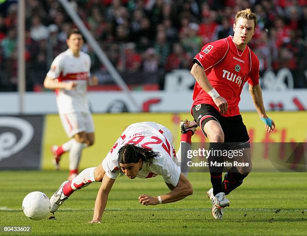 Hanno Balitsch of Hannover 96 and Sami Khedira of Stuttgart compete for the ball during the Bundesliga match between Hannover 96 and VfB Stuttgart at...