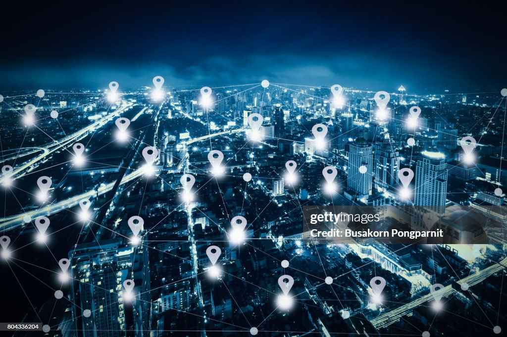 Abstract line connection on night cityscape with Map pin flat above network connection