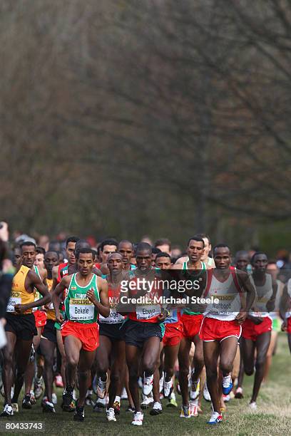 Kenenisa Bekele of Ethiopia, the eventual winner, competes with Joseph Ebuya of Kenya and Hasan Mahboob of Bahrain in the men's elite race during the...