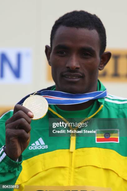 Ibrahim Jeilan of Ethiopia shows off his gold medal after victory in the men's Junior race during the 36th IAAF World Cross Country Championships at...