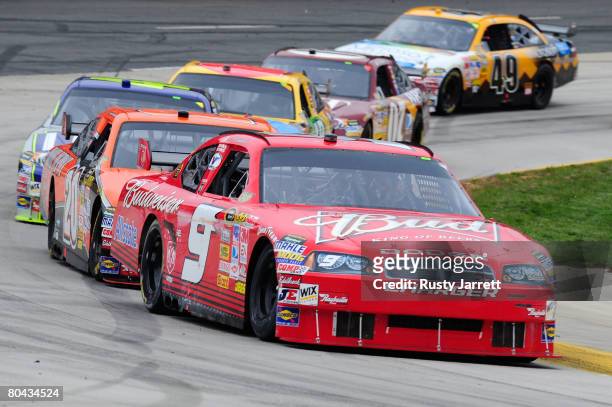 Kasey Kahne, driver of the Budweiser Dodge, leads a line of cars during the NASCAR Sprint Cup Series Goody's Cool Orange 500 at Martinsville Speedway...