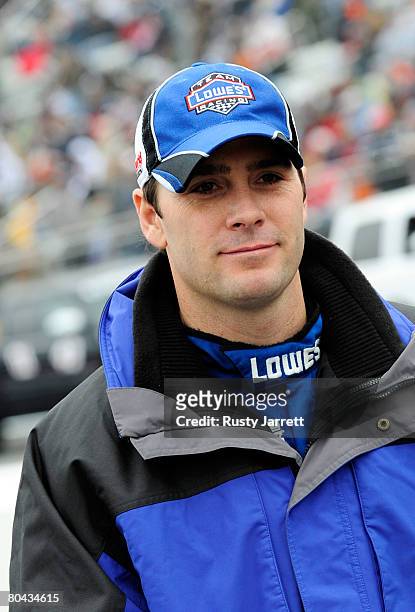 Jimmie Johnson, driver of the Lowe's Chevrolet, stands on pit road prior to the NASCAR Sprint Cup Series Goody's Cool Orange 500 at Martinsville...
