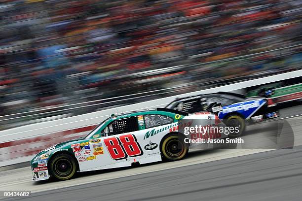 Dale Earnhardt Jr., driver of the AMP Energy/National Guard Chevrolet, races Regan Smith, driver of the Dale Earnhardt Inc./Principal Chevrolet,...