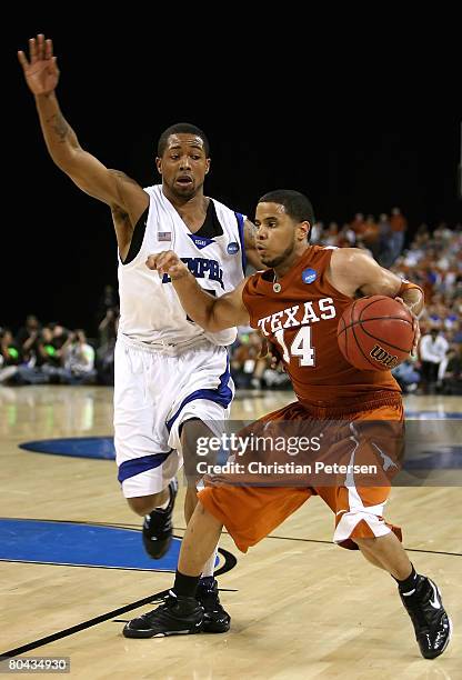 Augustin of the Texas Longhorns handles the ball under pressure from Antonio Anderson of the Memphis Tigers during the fourth round game of the South...