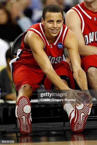 Stephen Curry of the Davidson Wildcats smiles as he stretches against the Kansas Jayhawks during the Midwest Regional Final of the 2008 NCAA Division...