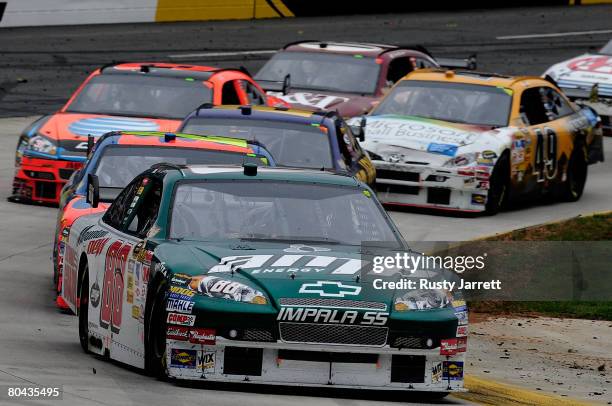 Dale Earnhardt Jr., driver of the AMP Energy/National Guard Chevrolet, leads the field during the NASCAR Sprint Cup Series Goody's Cool Orange 500 at...