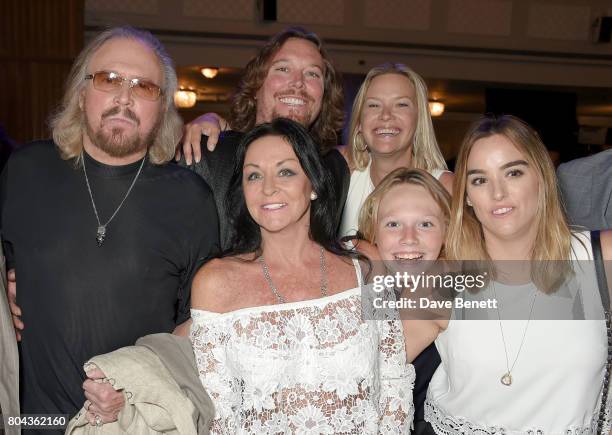 Barry Gibb, Ashley Gibb, Linda Gibb, Therese Gibb, Lucas Gibb and Alexandra Gibb attend the Nordoff Robbins O2 Silver Clef Awards at The Grosvenor...