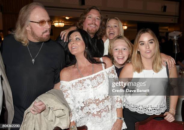 Barry Gibb, Linda Gibb, Ashley Gibb, Therese Gibb, Lucas Gibb and Alexandra Gibb attend the Nordoff Robbins O2 Silver Clef Awards at The Grosvenor...